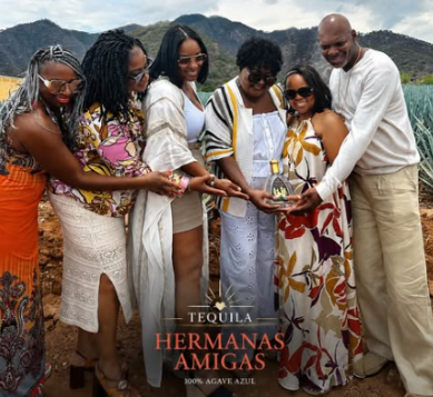 The Hermanas Amigas family together in the agave fields
